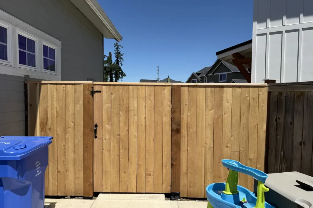 Cedar double drive gate wide enough for a trailer, built by Tekton Construction